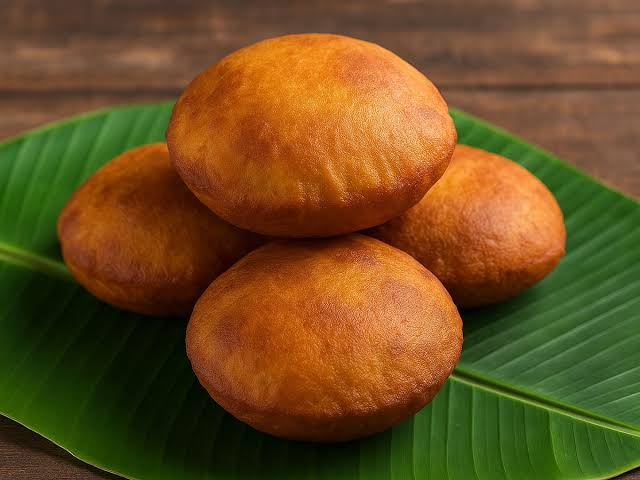 Golden brown fluffy Mangalore Buns served on a ceramic plate